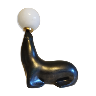 black iridescent blue terracotta sea lion lamp