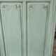 Cloakroom with sage green wall coats