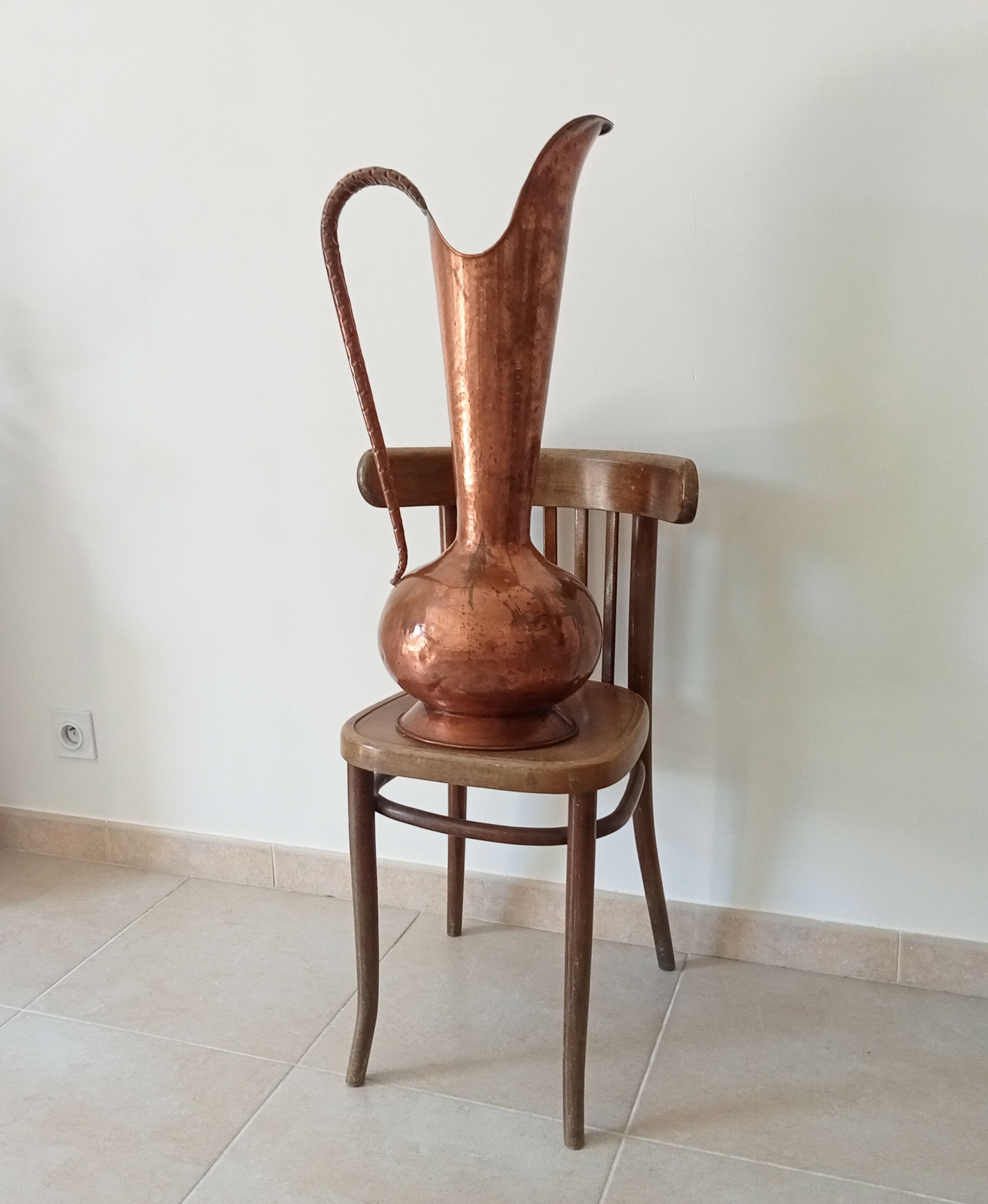 Old italian amphora vase in hammered copper