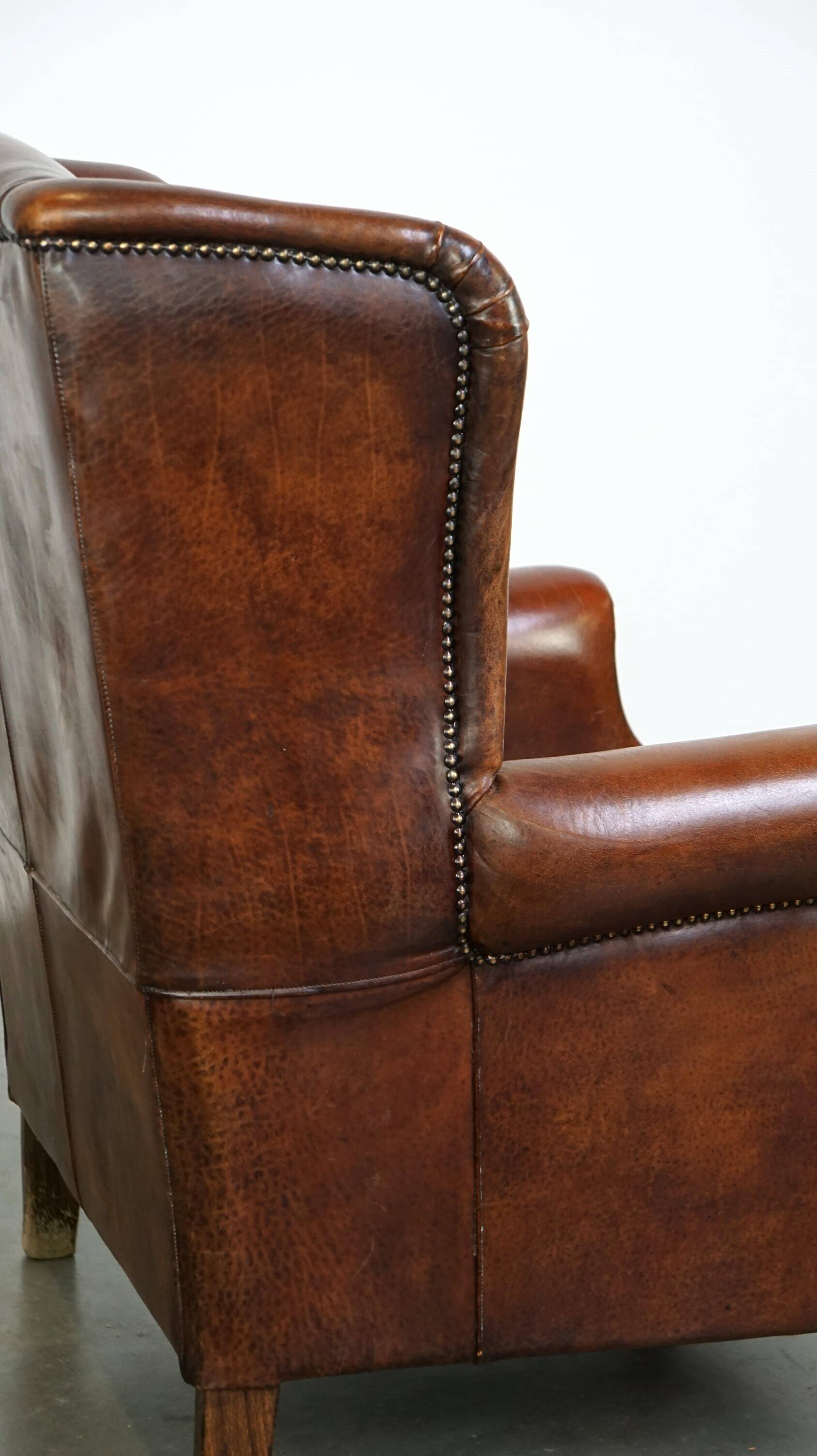 Large sheepskin wing chair with excellent colour and great seating comfort