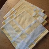 4 old yellow towels