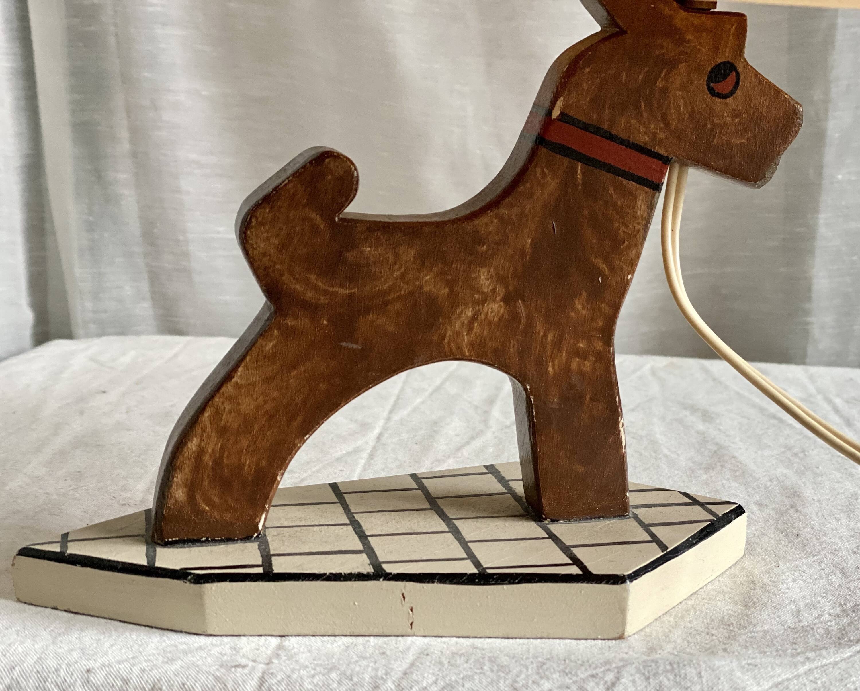 Vintage 1970s polychrome wooden lamp in the shape of a dog.