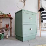 Old chest of drawers with two green drawers
