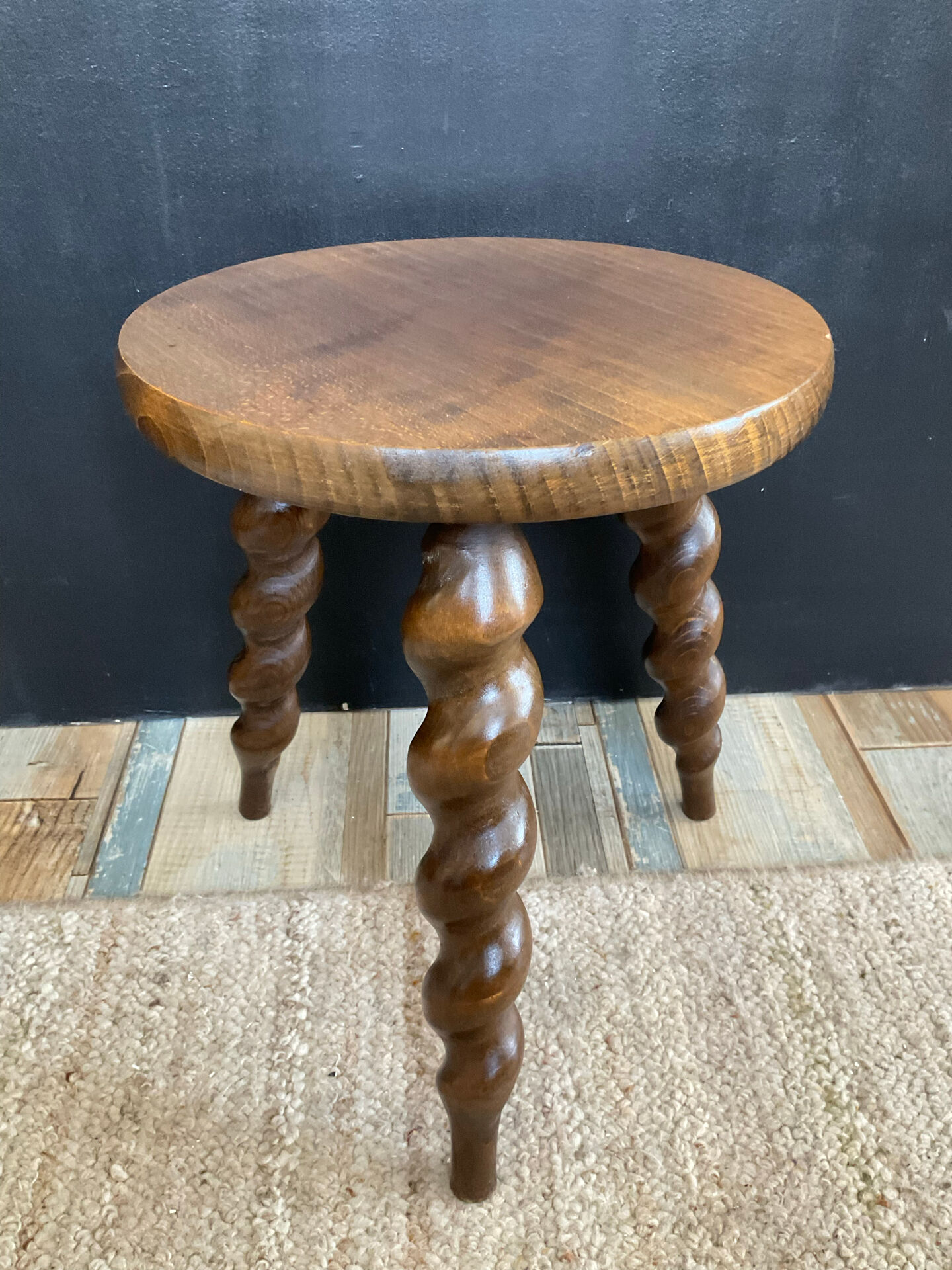 Antique tripod stool made of turned wood