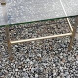 Vintage coffee table in gold and blackened metal with glass top from the 60s