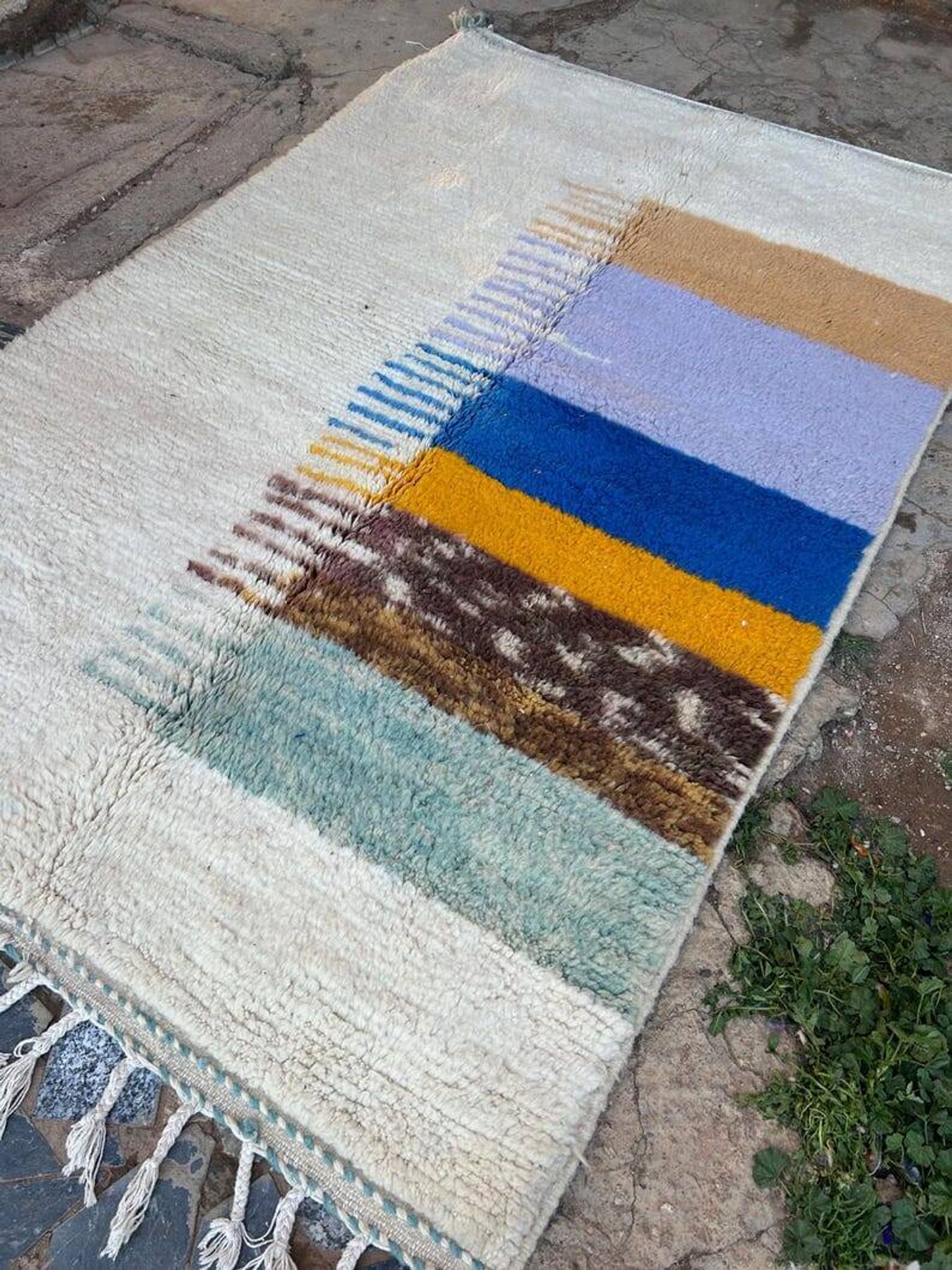 Handmade traditional pure wool rug with colourful patterns.