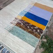 Handmade traditional pure wool rug with colourful patterns.