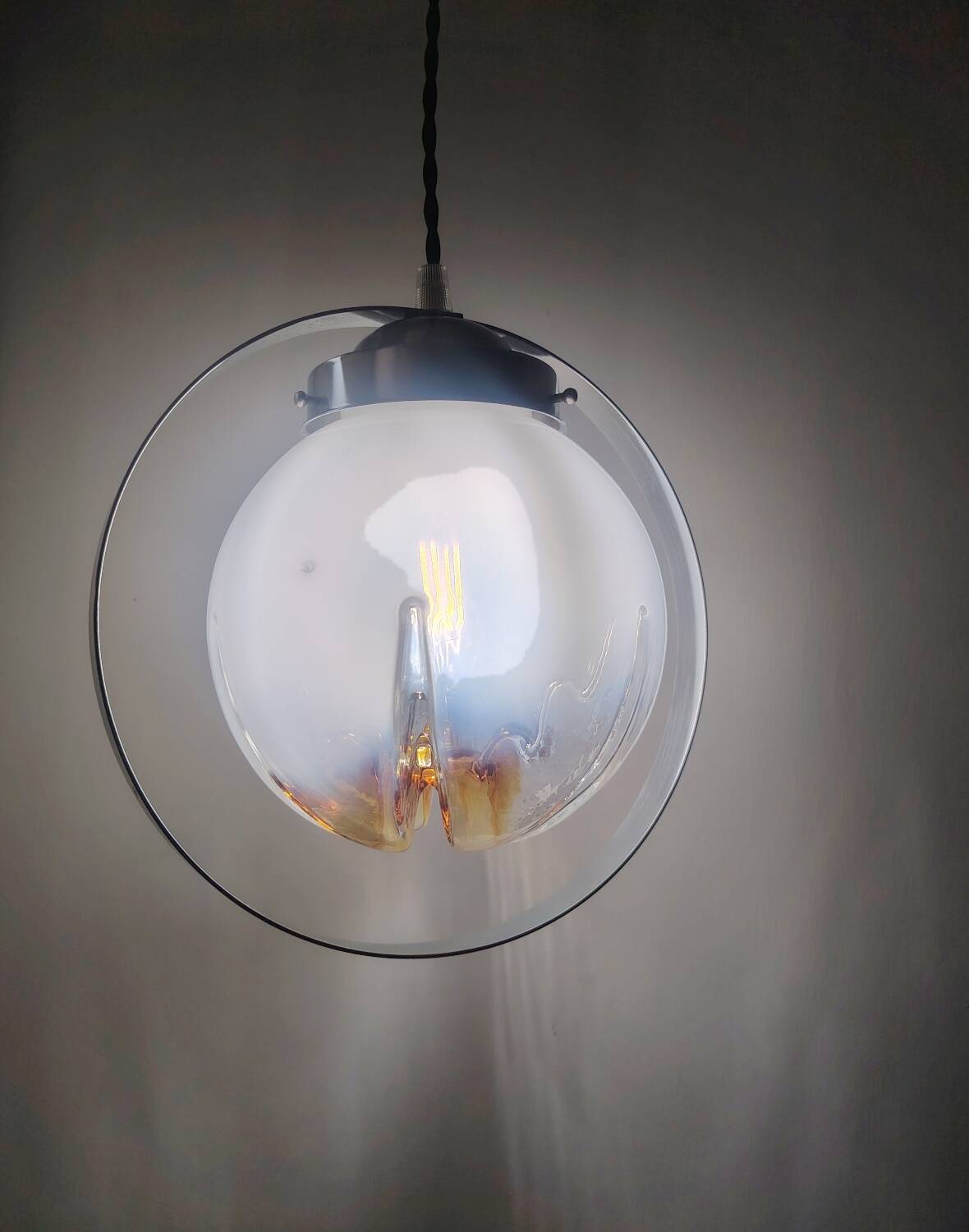 Murano mazzega suspended from a metal structure