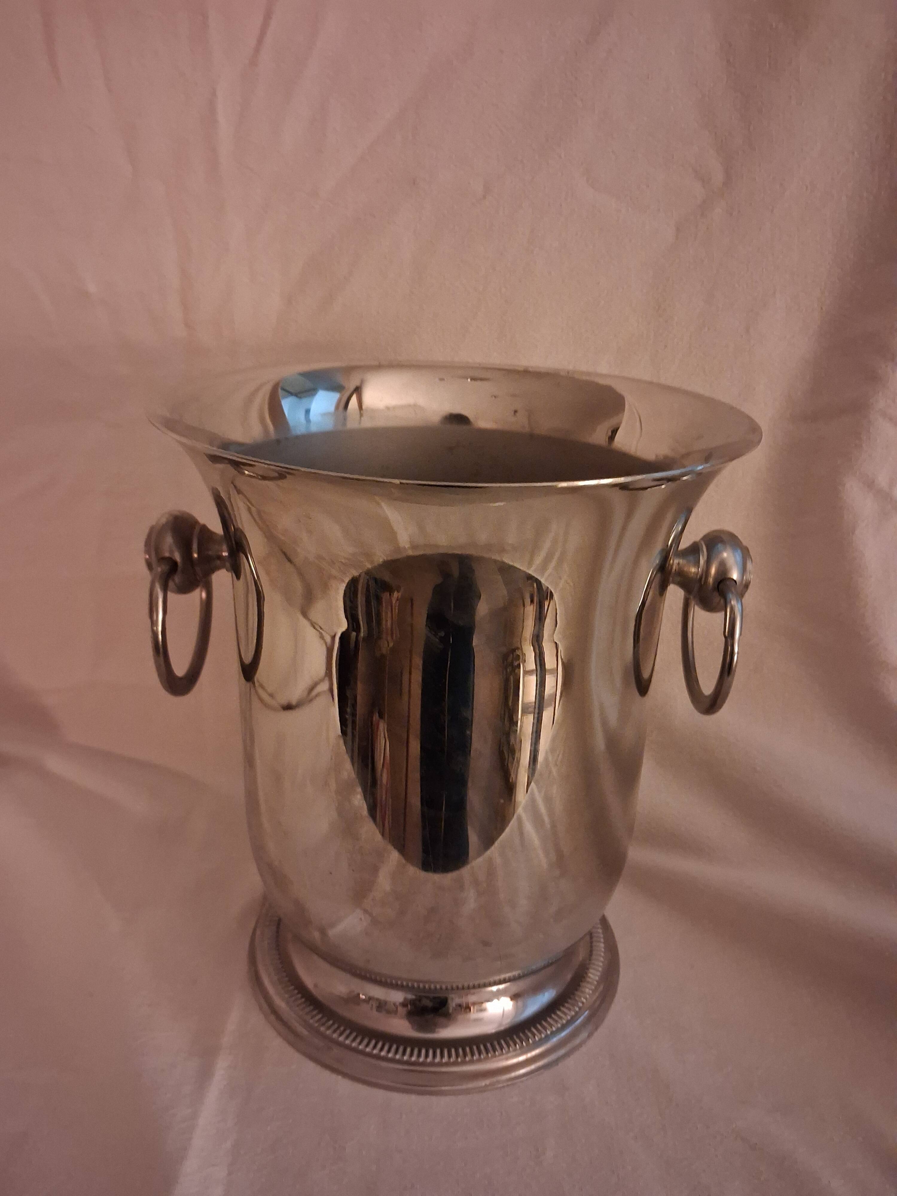 Stainless steel champagne bucket, silversmith Jean Couzon, model on a pedestal.