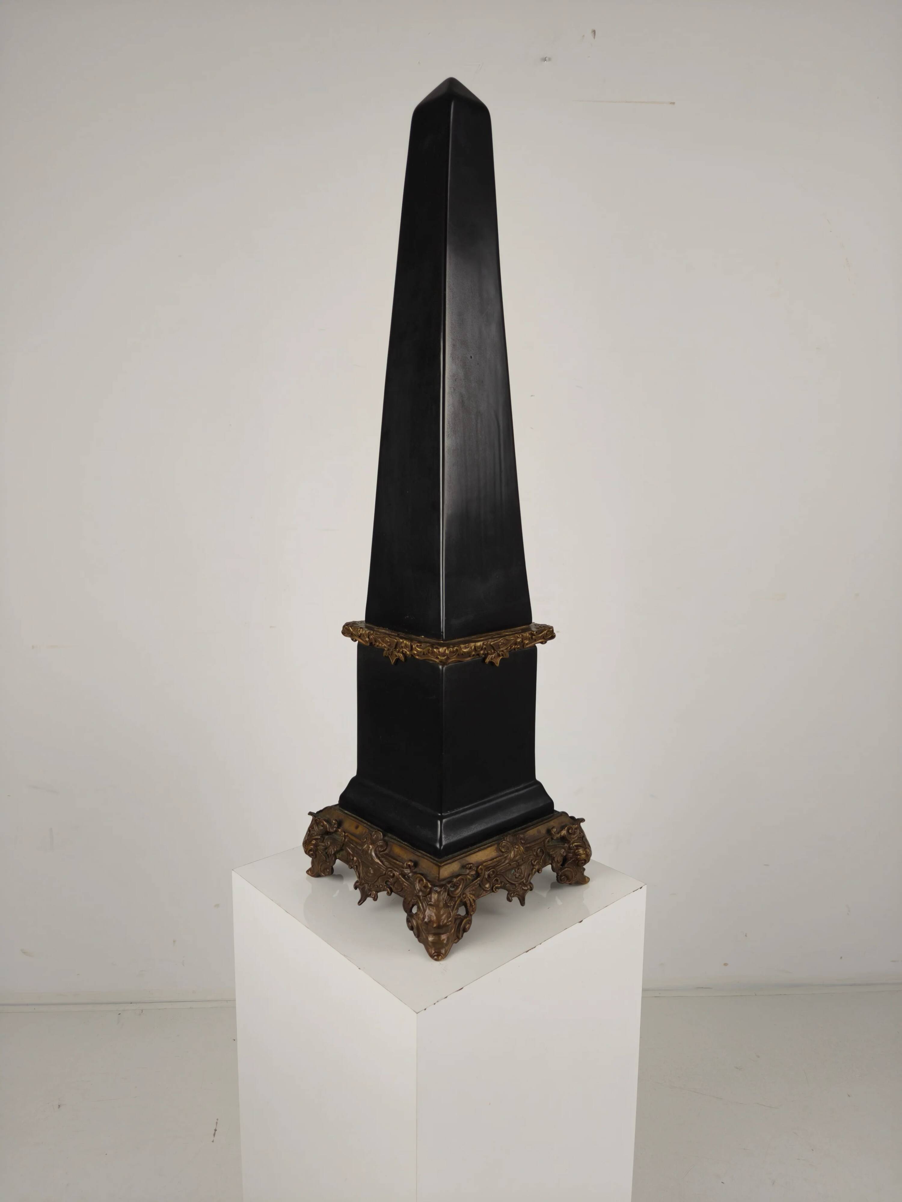 Black porcelain obelisk with bronze ornaments