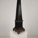 Black porcelain obelisk with bronze ornaments