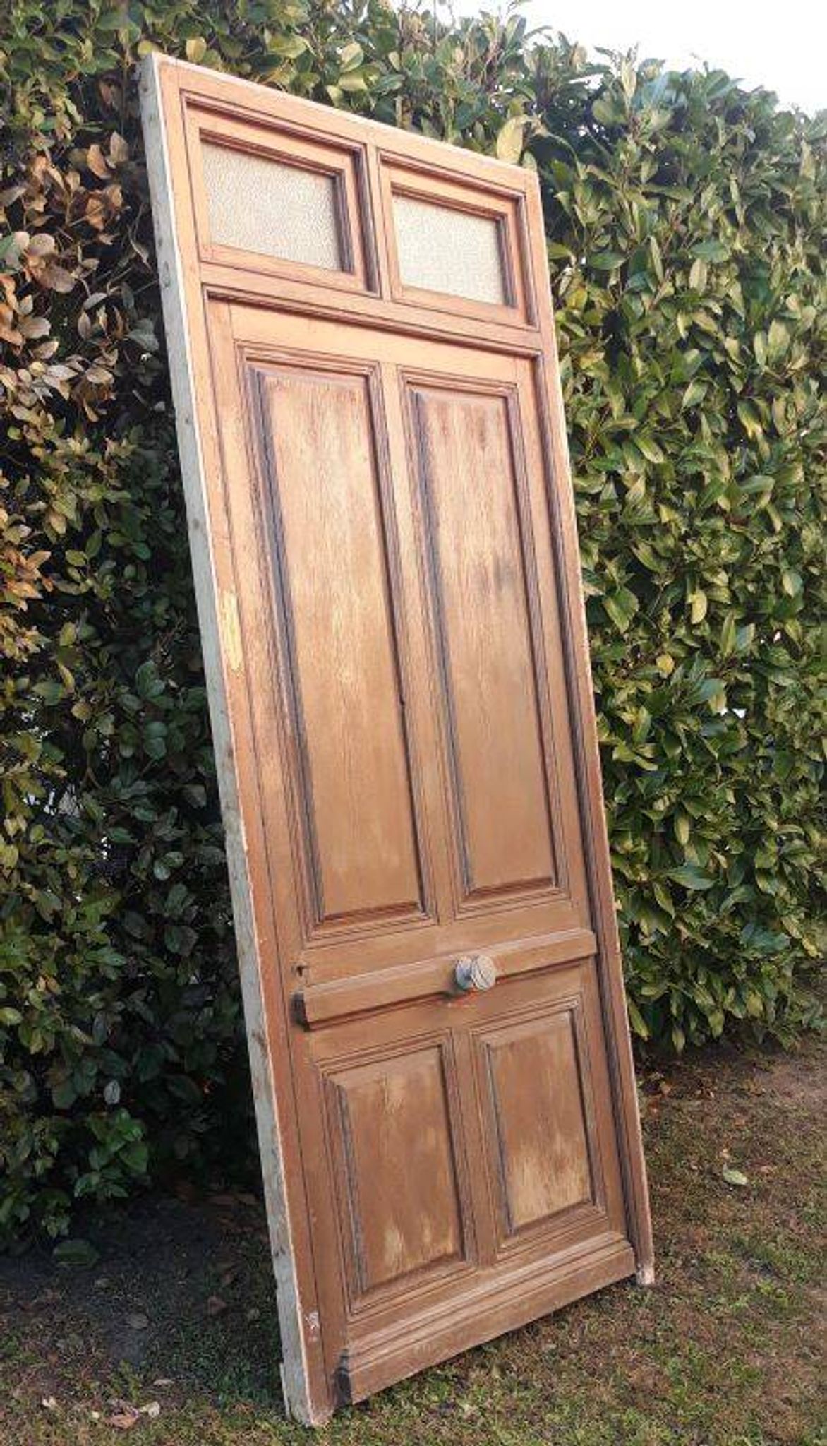 Porte d'entrée et son cadre imposte en verre translucide, début XXème