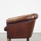 Sheepskin club armchair, correct finishing with decorative nails