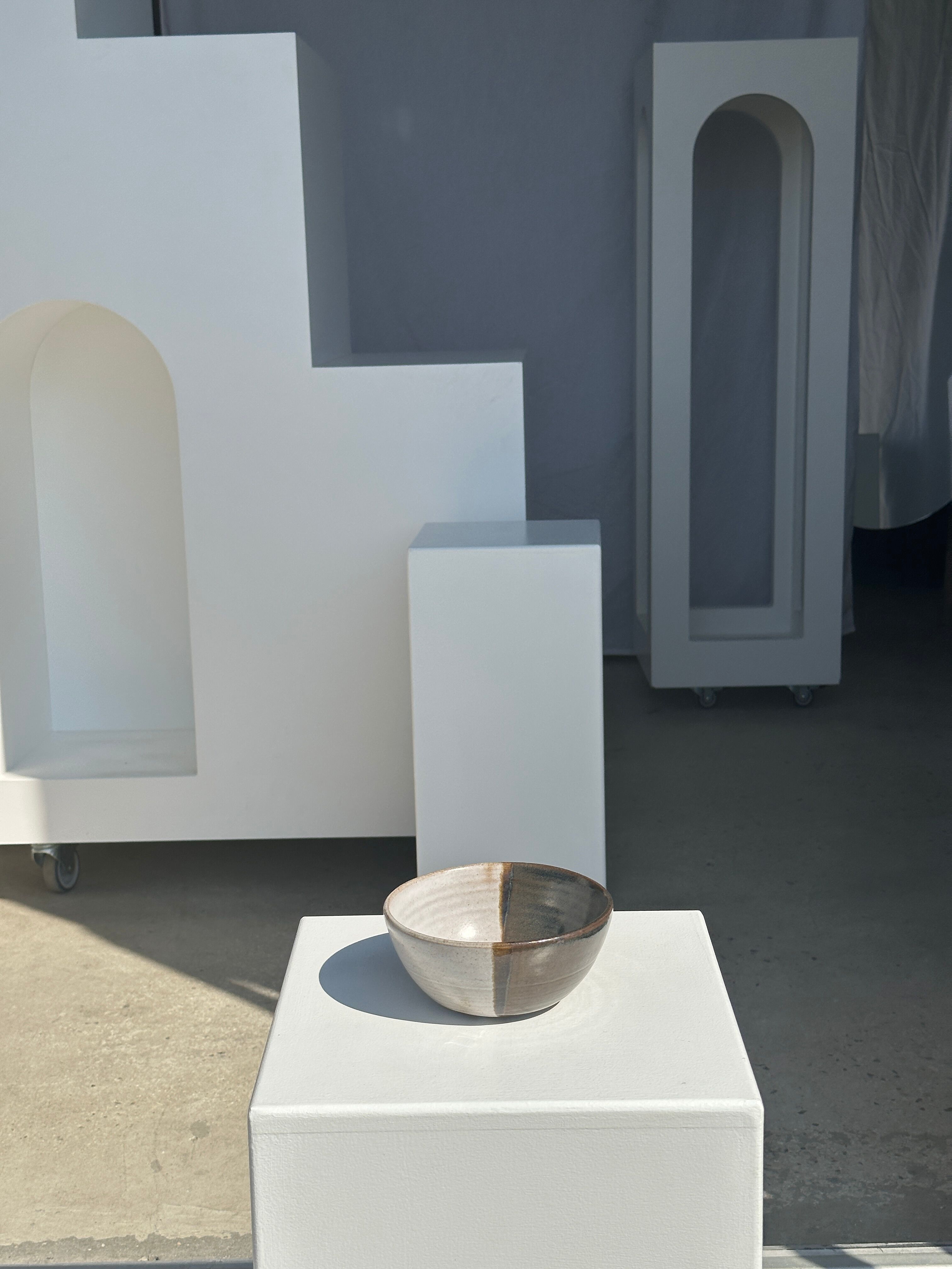 White and glossy brown two-tone ceramic bowl, matt earth