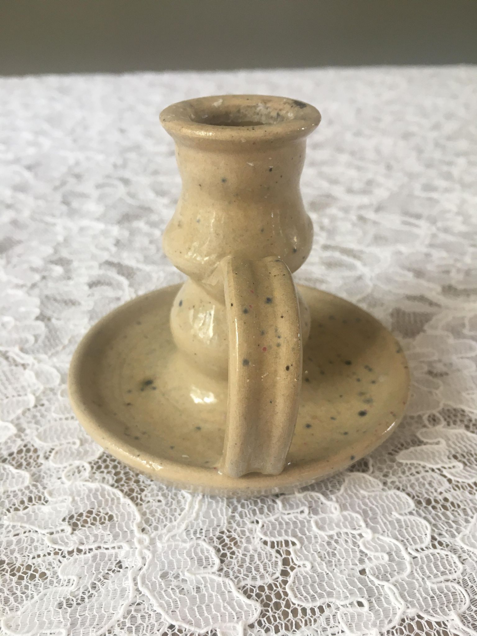 Pair of speckled sandstone candle holders