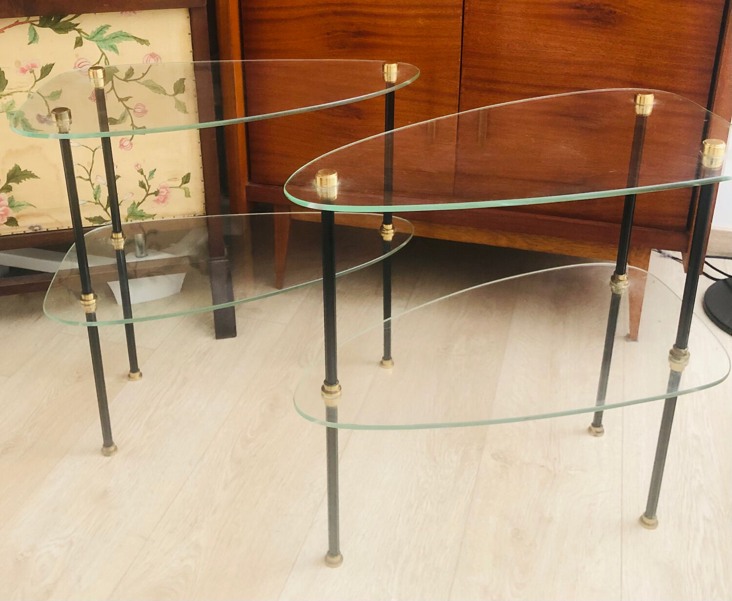2 small side tables in glass and Bakelite with gold nuts from the 1960s.
