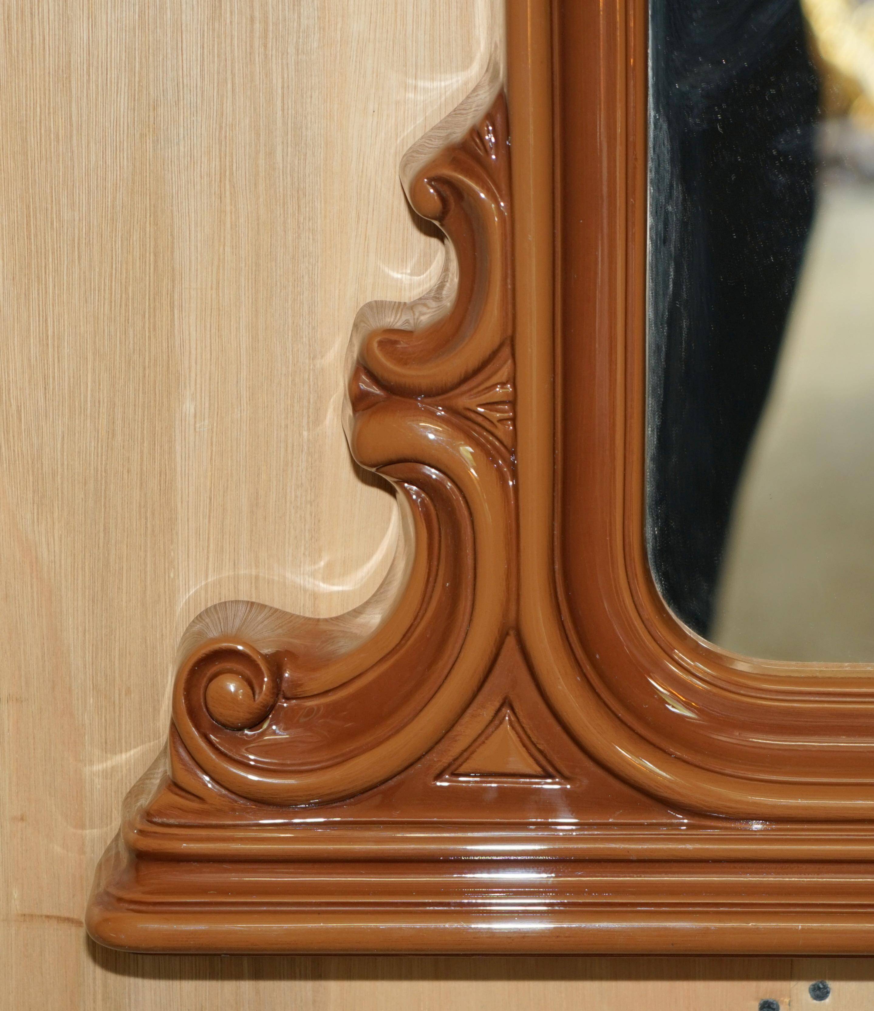 Vintage Art Deco decorative mirror with a thick frame.