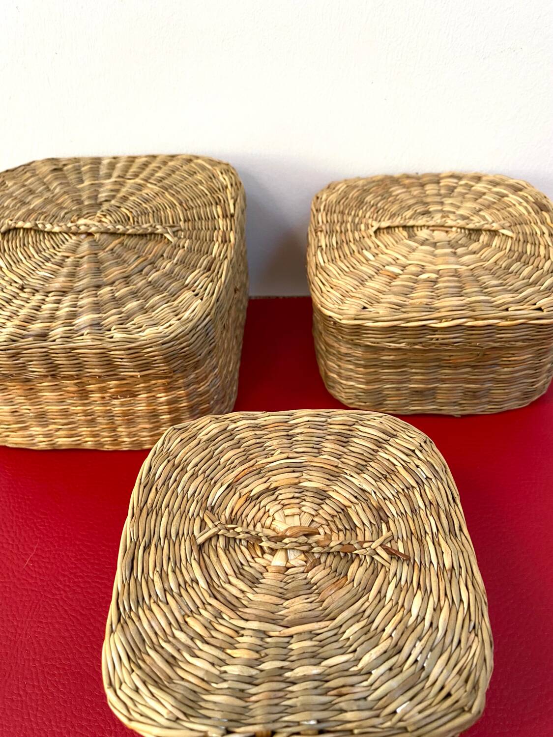 Vintage trio of small rattan nesting baskets