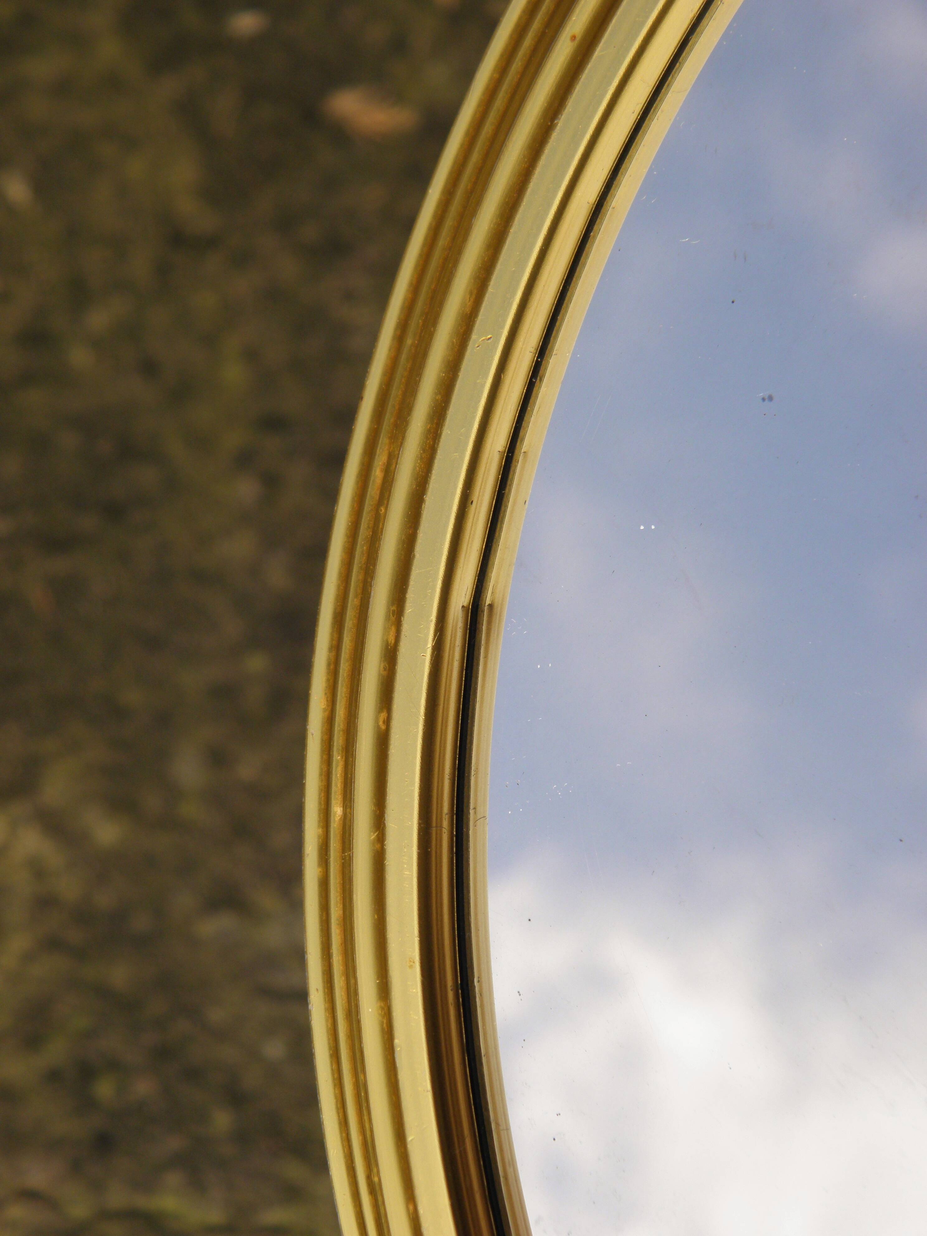 Round mirror with gold frame 31 cm