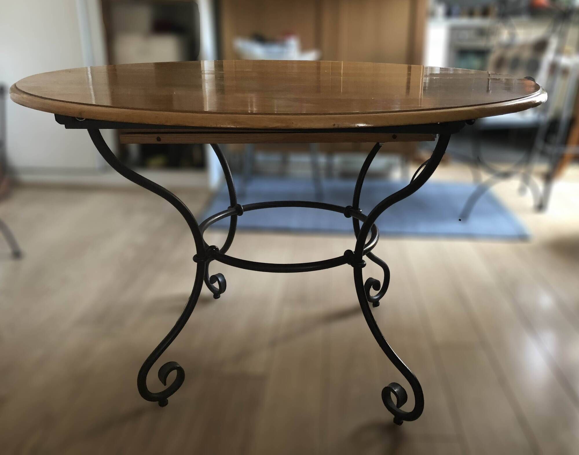Extendable table in solid oak with wrought iron legs.
