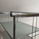 Design on feet in chromed metal and glass
