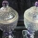 2 antique glass bonbonnières in the shape of pine cones.