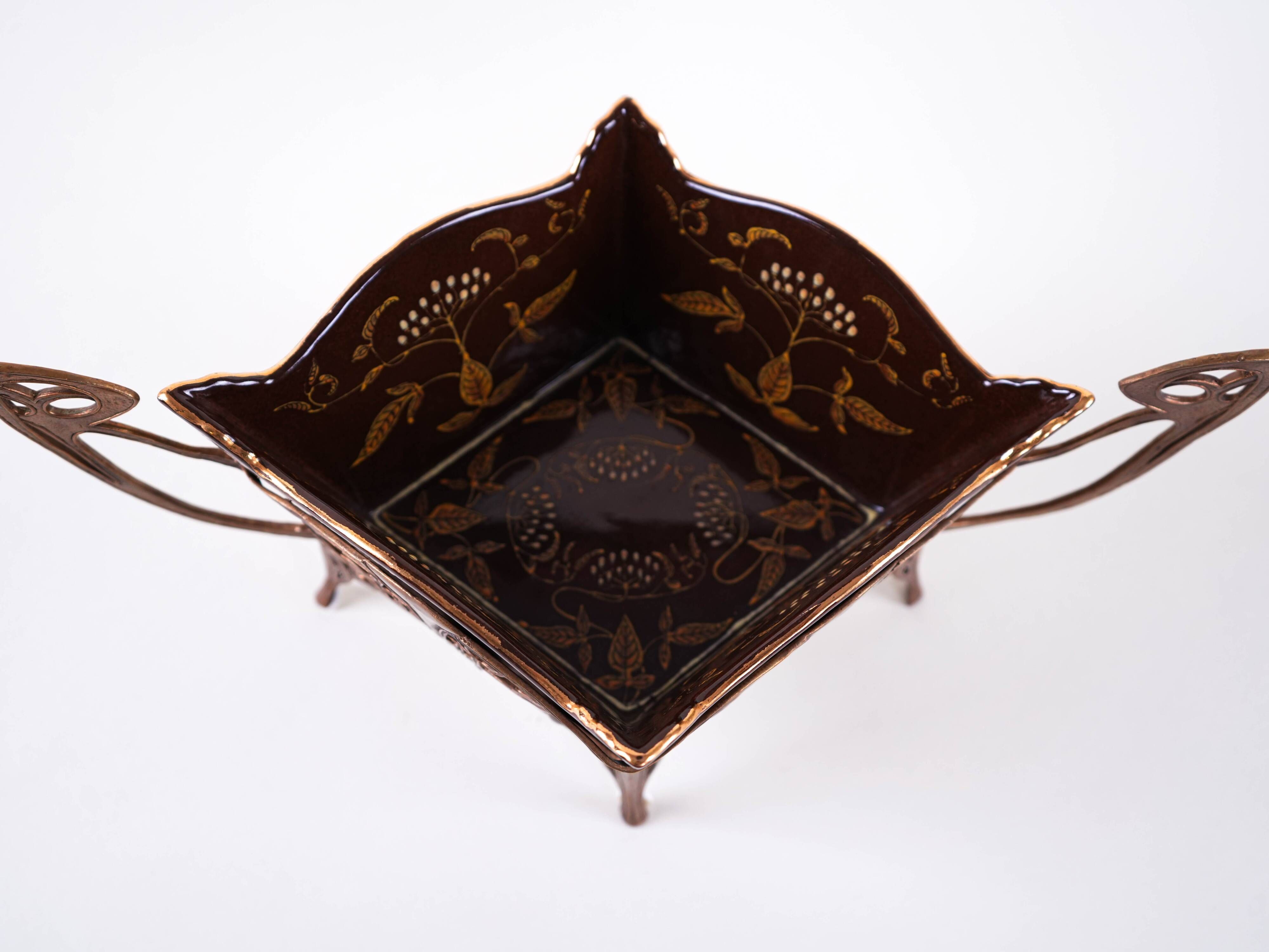 Art Nouveau platter with ceramic insert in openwork metal basket, burgundy glaze with gilt accents