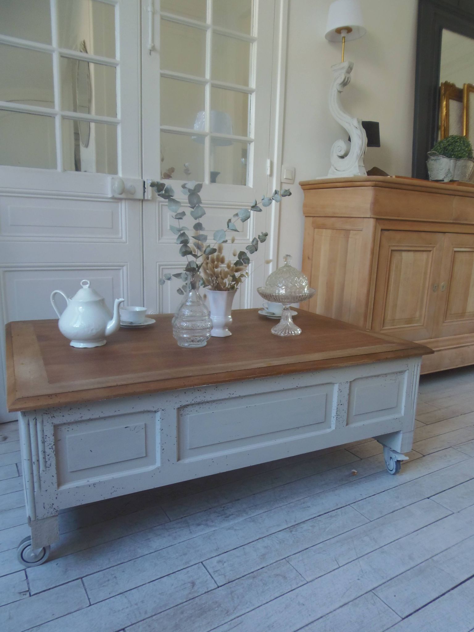 Coffee table on casters, made from an old desk, pearl gray base and belt.