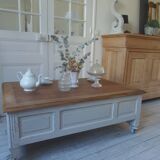 Coffee table on casters, made from an old desk, pearl gray base and belt.