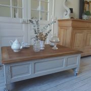 Coffee table on casters, made from an old desk, pearl gray base and belt.