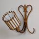 Rattan wall lights by Louis Sognot