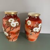 Pair of antique vases with butterfly and flower motif.