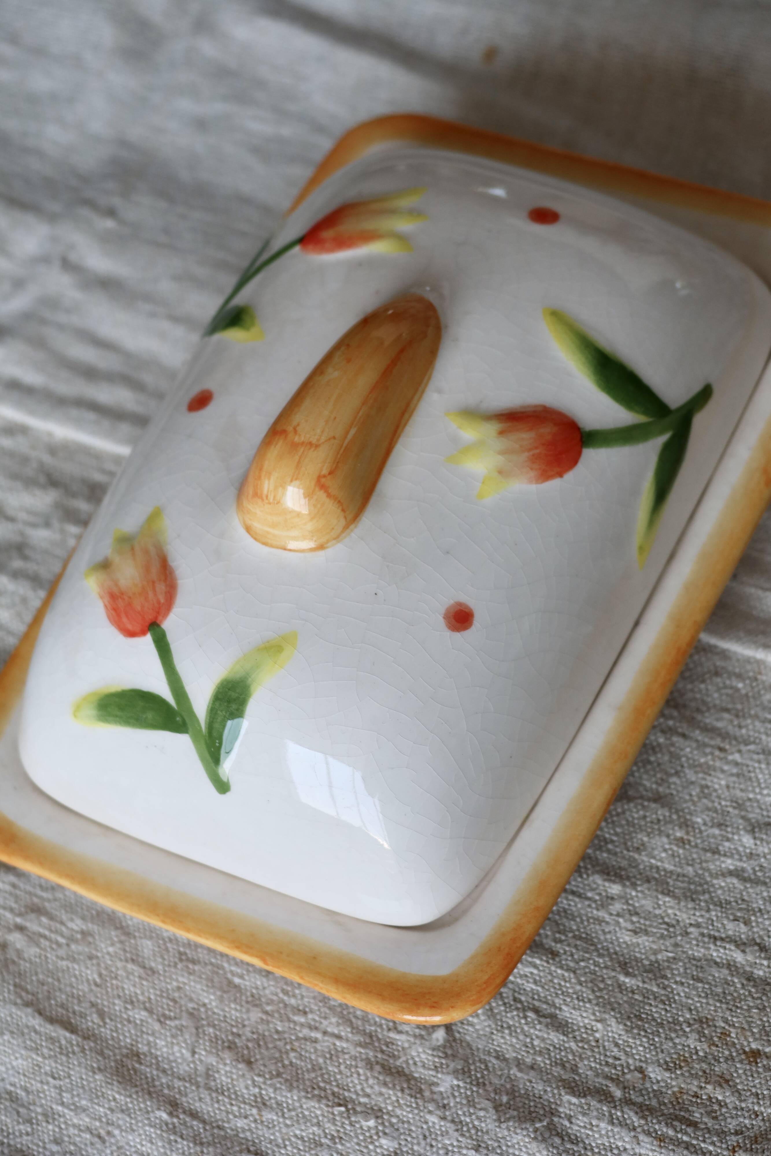 Vintage butter dish in earthenware and slip with tulip motif