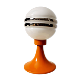 Orange metal and glass table lamp, circa 1960.