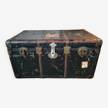Old and large travel trunk, brass-plated corners