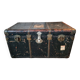 Old and large travel trunk, brass-plated corners