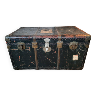 Old and large travel trunk, brass-plated corners