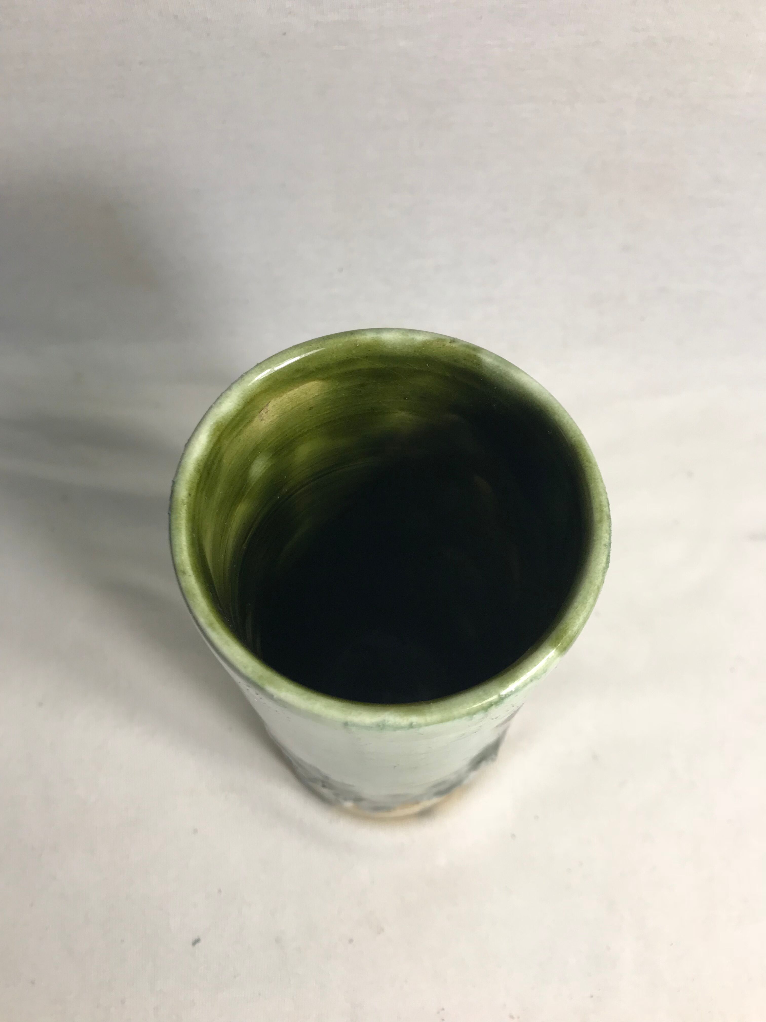 Roll old glazed ceramic vase green