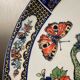 Grand plat à décor de Paons et fleurs XX siècle