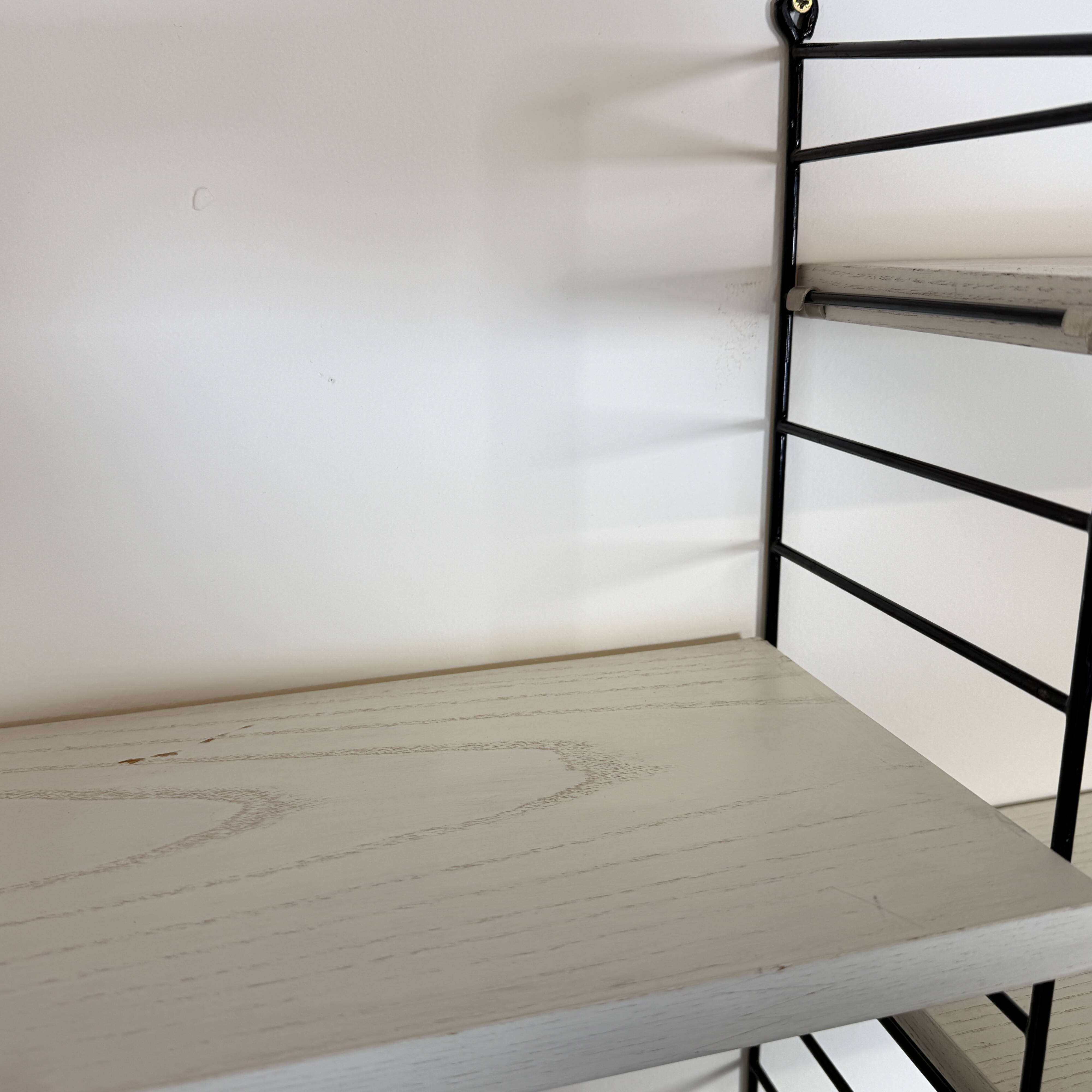 Vintage Nisse Strinning wall rack with 7 white shelves