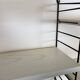 Vintage Nisse Strinning wall rack with 7 white shelves