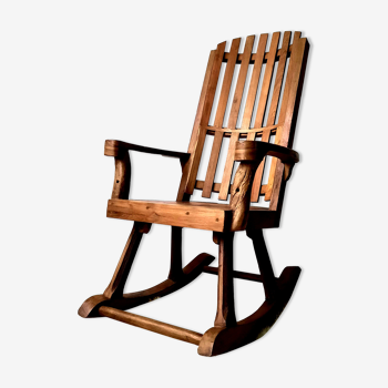 Rocking chair in solid teak from the 50s