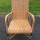 Antique high-back rattan armchair