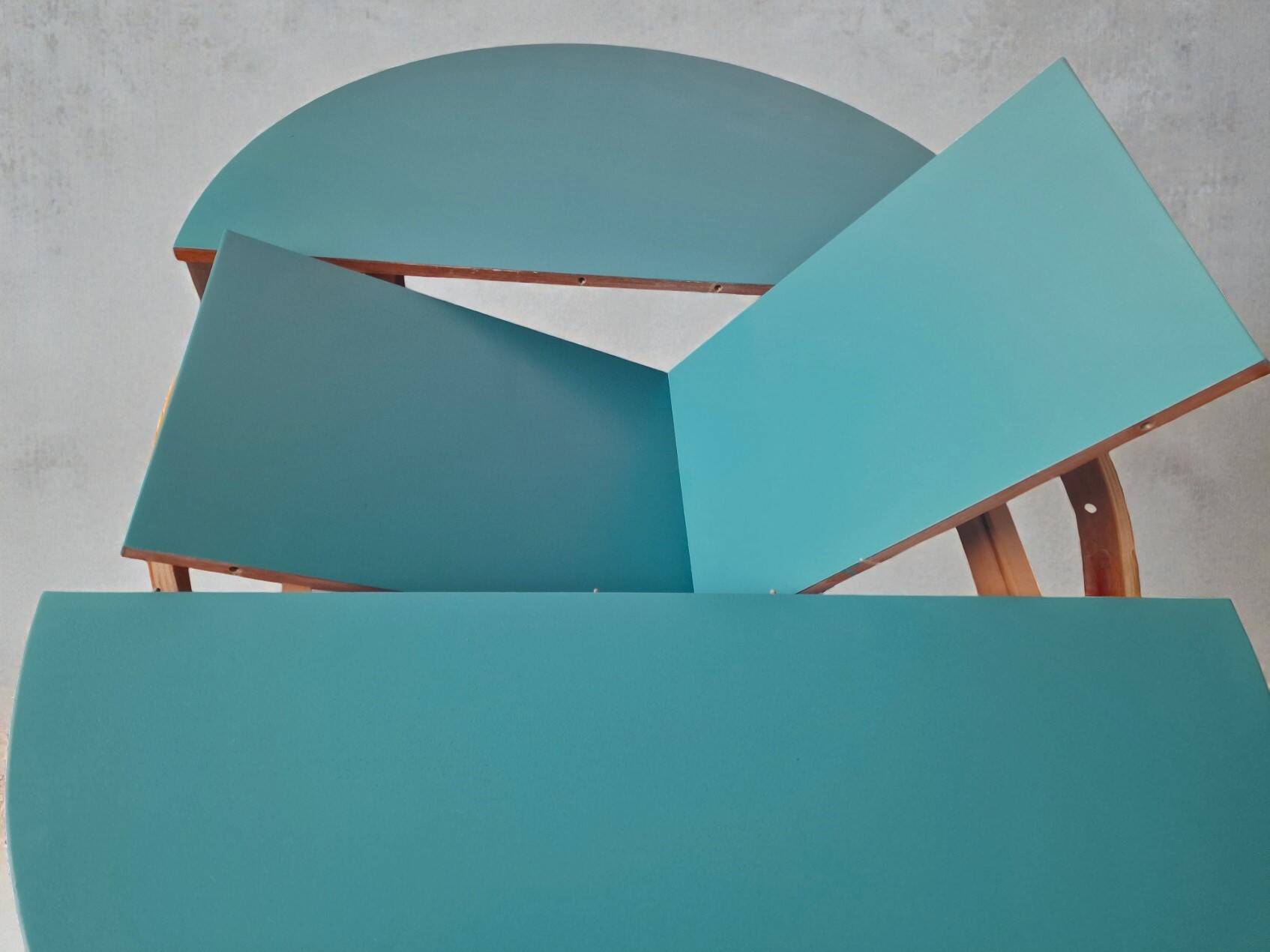 Extendable oval teak dining table