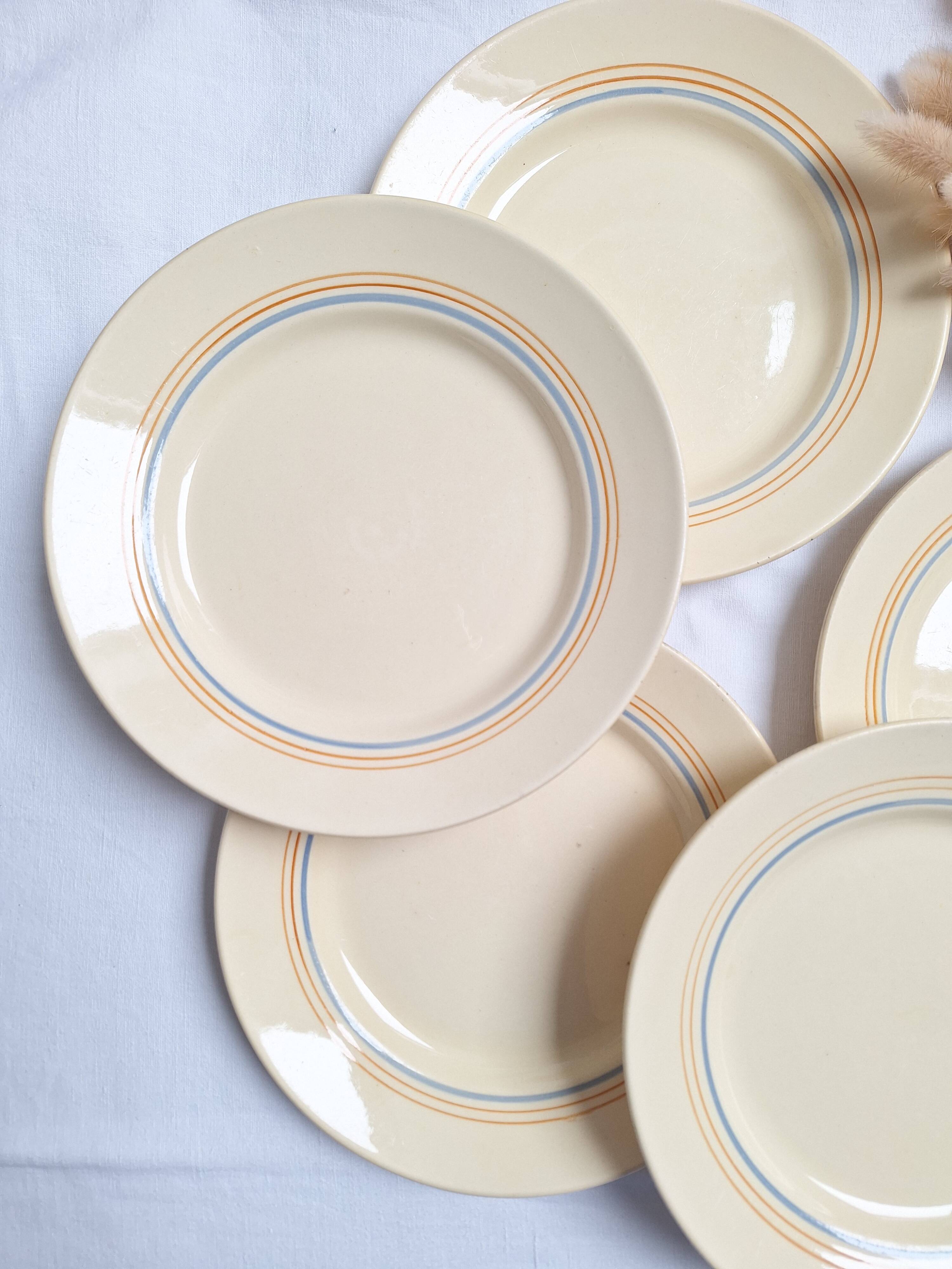 Vintage cream, orange and blue dinner plates.