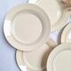Vintage cream, orange and blue dinner plates.