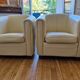 A pair of genuine leather club armchairs.