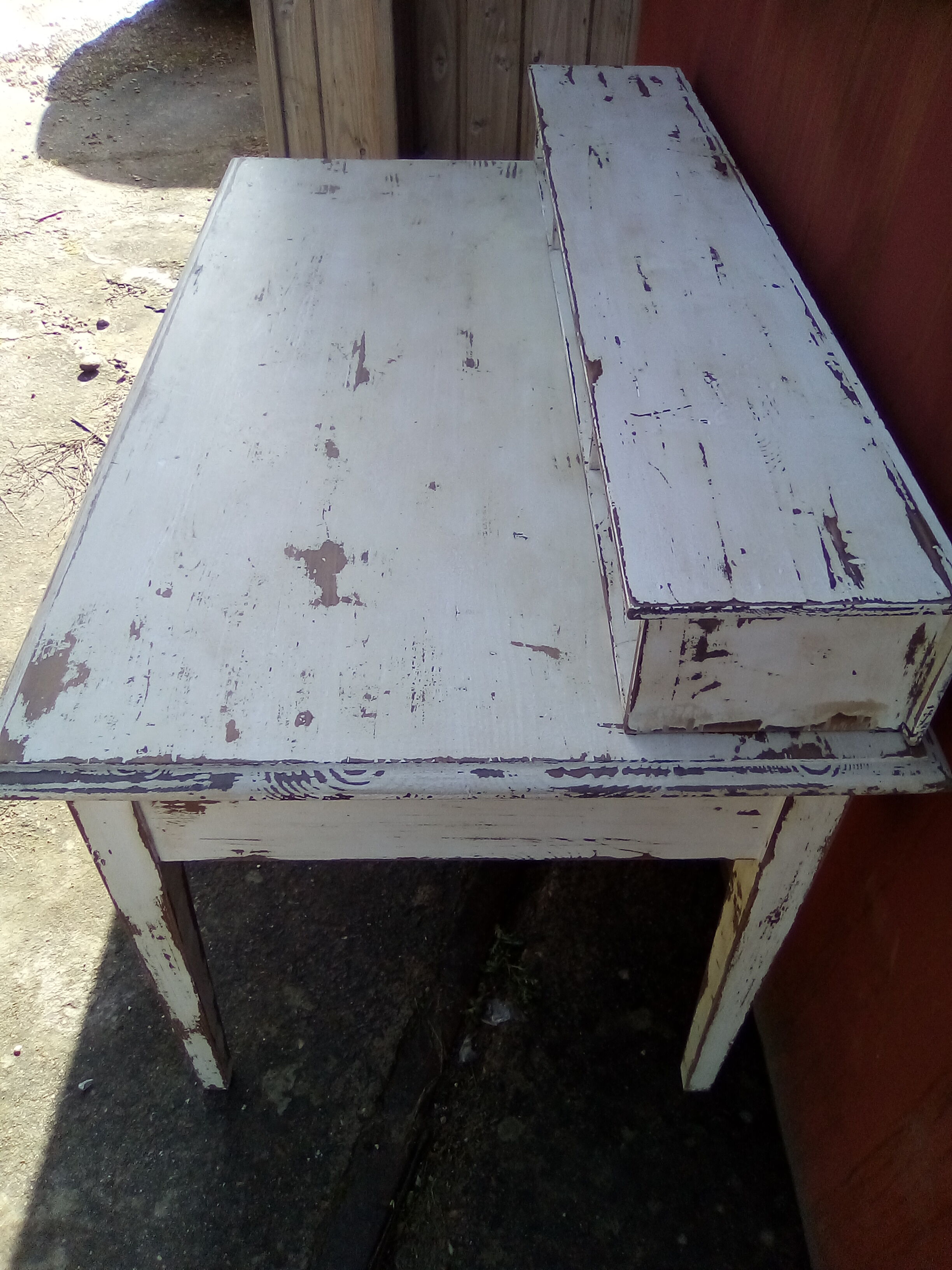 Large wooden desk with patinated bleacher