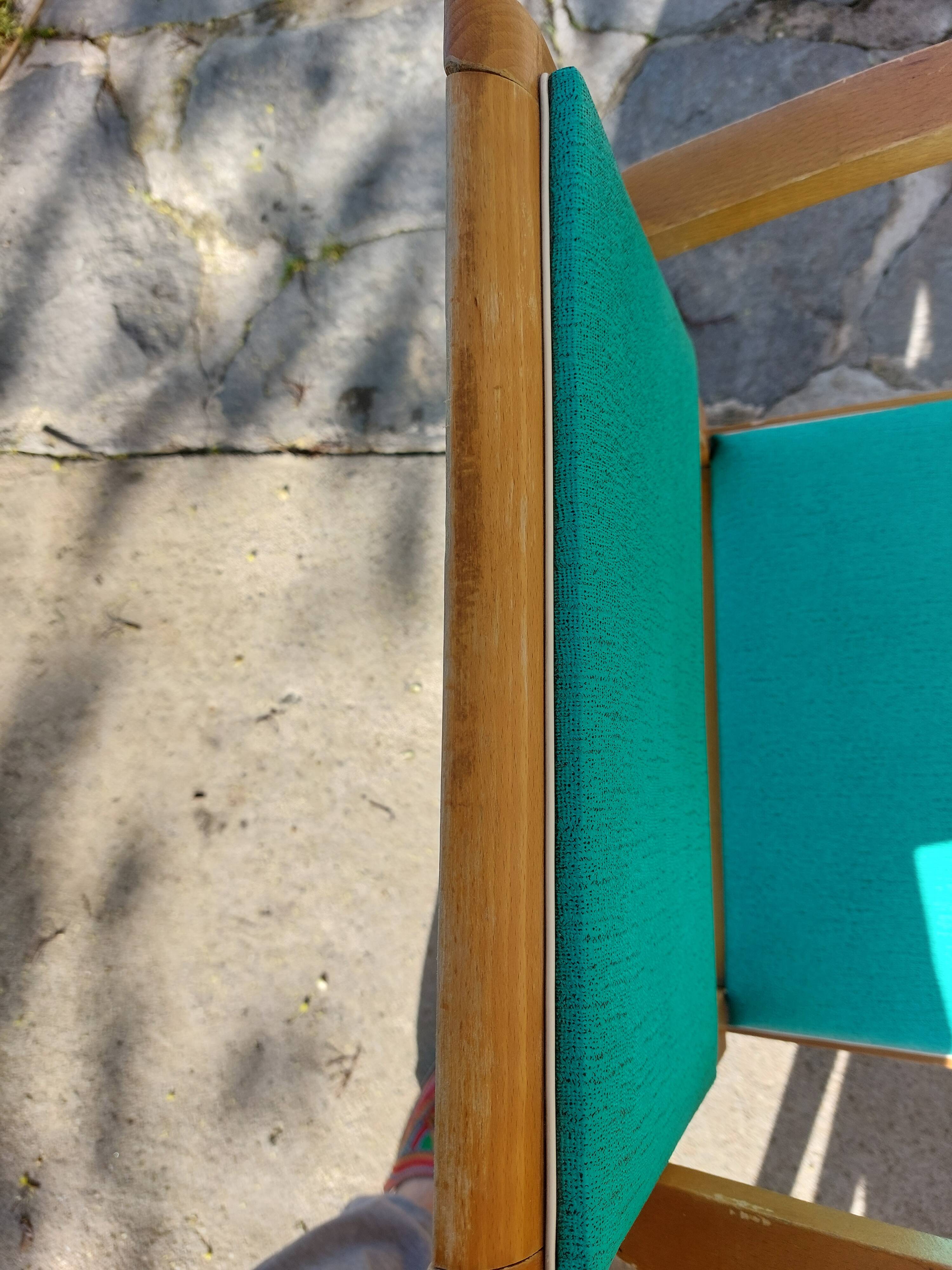 3 vintage bridge chairs with rounded armrests.