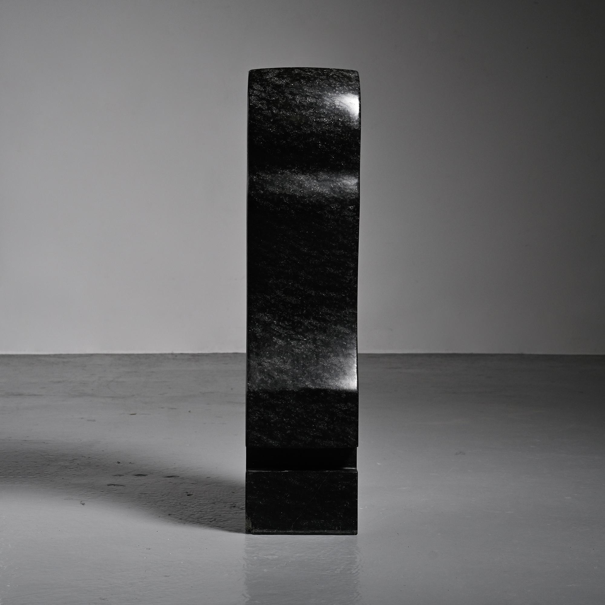 Abstract sculpture in diabase by Robert Neuhauser, Switzerland, circa 1985.